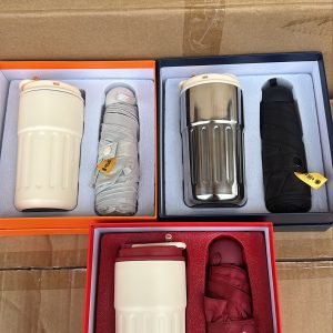 Umbrella and portable vacuum tumbler set